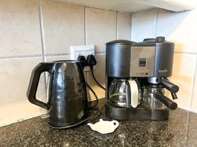 a coffeemaker and a coffee maker on a counter at Century Hideaway with Mountain views, Security, FREE Parking in Cape Town