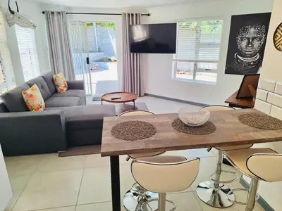 a living room with a couch and a table at Dee-Ones at Witboom,Kenridge ,Self Catering Apartment in Kenridge