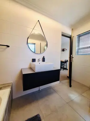 a bathroom with a white sink and a mirror at Dee-Ones at Witboom,Kenridge ,Self Catering Apartment in Kenridge