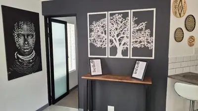 a room with two pictures on the wall at Dee-Ones at Witboom,Kenridge ,Self Catering Apartment in Kenridge