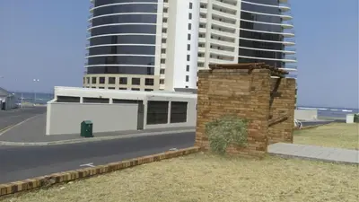 a rendering of a building in front of a tall building at Ocean Elephant Beach Apartment LONG TERM in Strand