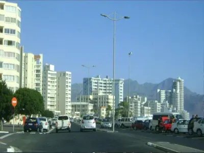 a city with cars parked in a parking lot at Ocean Elephant Beach Apartment LONG TERM in Strand