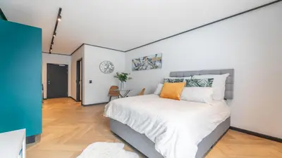 a bedroom with a large bed in a room at Little island in Cape Town