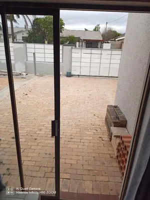 a view of a patio from a sliding glass door at Jennings breeze in Cape Town