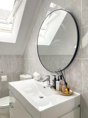 a bathroom with a white sink and a mirror at Duplicate in Franschhoek