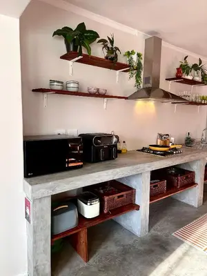 a kitchen with a counter with pots and pans at Die Klein Huis in Cape Town
