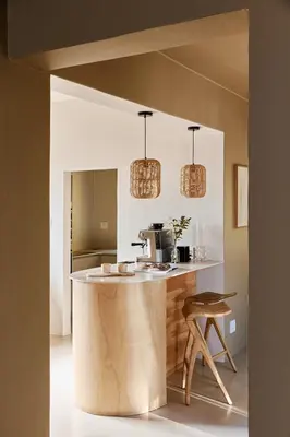 a kitchen with a island in the middle of a room at Kokon Boutique Guesthouse in Somerset West