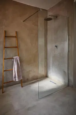 a shower with a glass door in a bathroom at Kokon Boutique Guesthouse in Somerset West