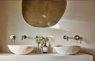 a bathroom with two sinks and a mirror at Kokon Boutique Guesthouse in Somerset West
