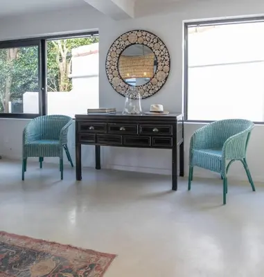 a desk with two chairs and a mirror at Les Baleines Hermanus Villa in Hermanus