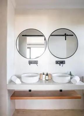 two mirrors above two sinks in a bathroom at Les Baleines Hermanus Villa in Hermanus