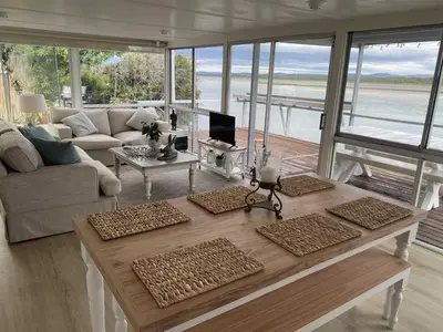 a living room with a couch and a table at Moonshine in Hermanus
