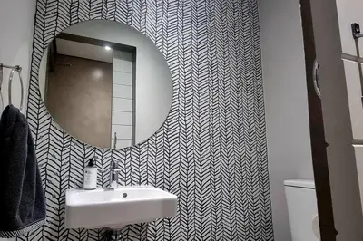 a bathroom with a sink and a mirror at C'est la Vie 4 in Franschhoek