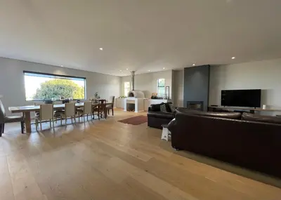 a living room with couches and a dining room at The View in Cape Town
