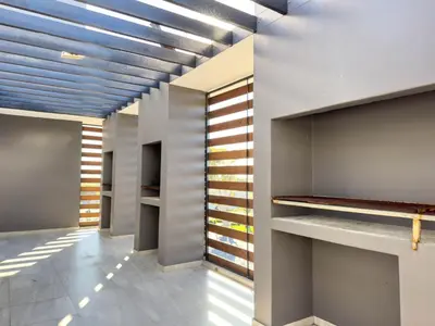 a hallway with a row of walk in closets at Greystone Executive Apartments in Cape Town