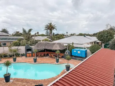 an aerial view of a house with a swimming pool at Ilanga Du Cap Hotel in Cape Town
