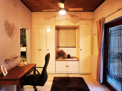 a home office with a desk and a chair at Budget Haven Durbanville in Cape Town