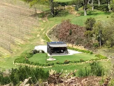 an aerial view of a house in a field at Babylons Tower Shepherds Hut in Mosselrivier