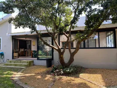 a house with a tree in front of it at no 5 King Street, Onrus in Hermanus