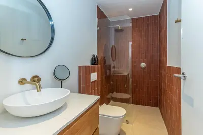 a bathroom with a sink and a shower at Maison la Bruyere, 8p villa - heated pool, airco & hottub in Franschhoek