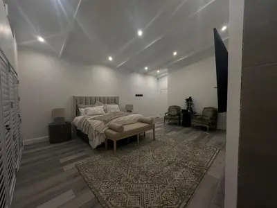 a bedroom with a bed and a rug at Comfort Cove in Cape Town