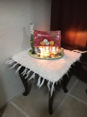 a table with a plate of food and a bag on it at The Pink Door in Caledon