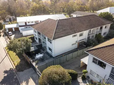 an overhead view of a white house with a roof at Avemore Vredehof 1 with backup power in Stellenbosch