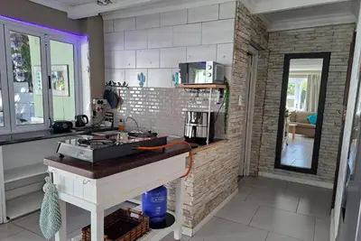 a kitchen with a sink and a counter top at The Willow Cottage in Cape Town