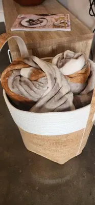 a basket full of bread sitting on a table at Stellenbosch Paradijs Cottage Paradyskloof in Stellenbosch