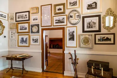 a room with a hallway with pictures on the wall at Protea Hotel by Marriott Cape Town Mowbray in Cape Town