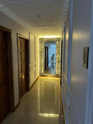 an empty hallway with a door and a mirror at Luxurious 4 bedroom Family Home in Cape Town