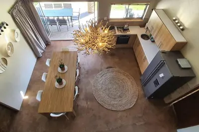 an overhead view of a living room with tables and chairs at Riverbank in Tulbagh