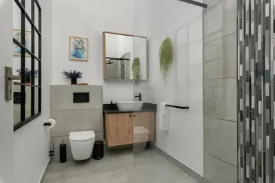 a bathroom with a sink and a toilet and a mirror at Tafelzicht Peaceful Retreat - Wifi - Netflix in Cape Town