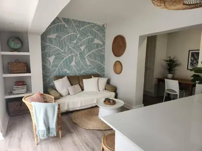a living room with a couch and a table at No 4 Life at Sea in Strand