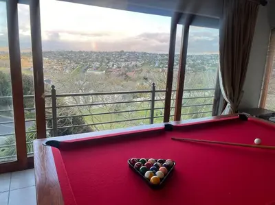 a red pool table in a room with a view at Divine View in Cape Town