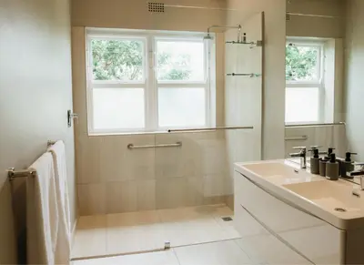 a white bathroom with a sink and a shower at 13 Olives, Entire Grape & Olive Estate, Somerset West by Euphoric Leisure in Sir Lowryʼs Pass