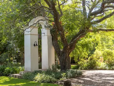 a tree in a park with a monument at The Huts - Glamping at Caledon Grace in Caledon