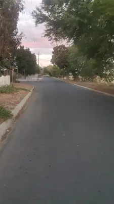 an empty street with trees on the side of the road at Transvaal Road, N1 in Worcester