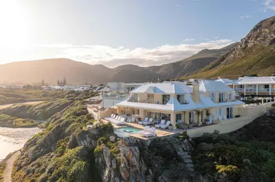 an aerial view of a house on a cliff at Birkenhead House in Hermanus