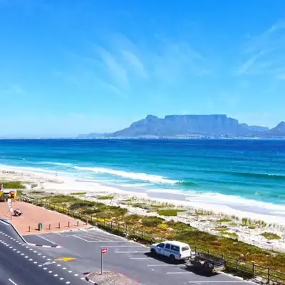 Unwind at Coral 2BR Bloubergstrand Beach Apt Walk to Beach