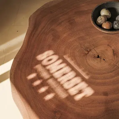 a wooden cutting board with a bowl of eggs on it at YEBO Boutique Guesthouse in Somerset West