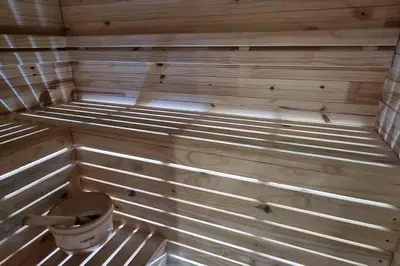 a inside of a sauna with a bucket in it at C'est la Vie 5 Garden View Apartment in Franschhoek