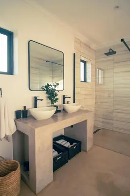 a bathroom with two sinks and a mirror at Wildeberg Dam House Cottage in Franschhoek