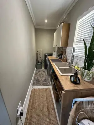 a kitchen with a counter top and a sink at Strand Holiday home in Cape Town