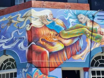 a painting of a mermaid on the side of a building at Obs Centre Twin Peaks in Cape Town