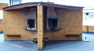 a large brick building with two windows in it at Montana Backpackers Cape Town in Cape Town