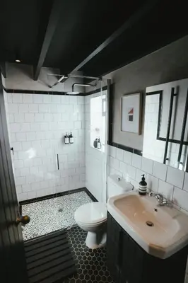 a bathroom with a white toilet and a sink at No 3 at The Barracks in Stellenbosch