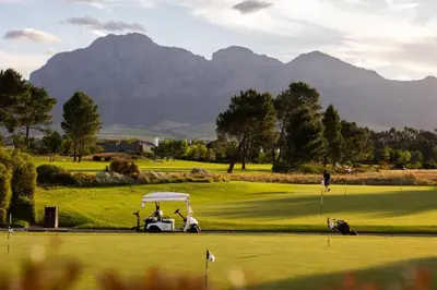 a golf course with mountains in the background at Luxury Lodge 4F Pearl Valley Golf Estate in Simondium