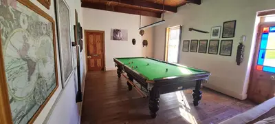 a hallway with a pool table in a room at Whipstock Guest Farm in McGregor