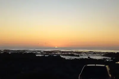 a car parked in front of a sunset at Mogit-ewig-duur in Hermanus
